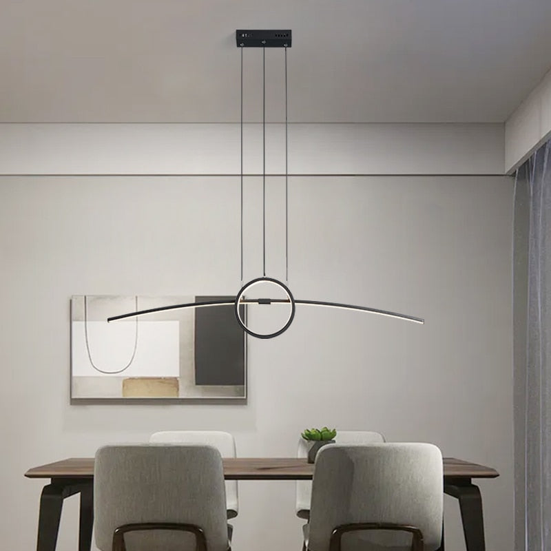 Black Dreoon Modern LED Pendant Chandelier Light for Kitchen, Dining Room and Living Room placed above the dining table