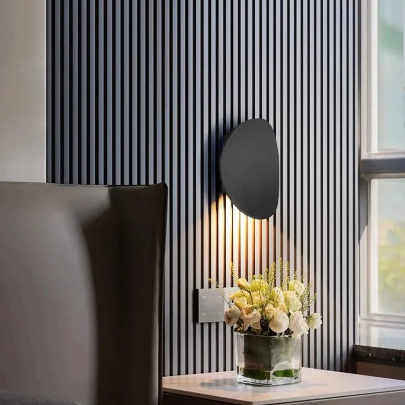 Black Disc LED Wall Lamp wall for bathroom, bedroom, kitchen and living room place on grill like texture background