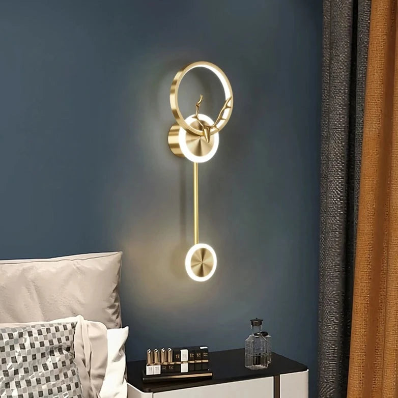 Sidewise view of Light-on Stunning Golden Deer LED Wall Lamp placed aside to the Bed